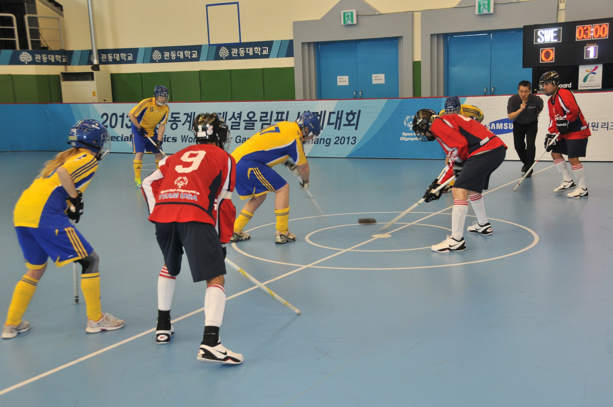 Members of the Special Olympics Team USA Unified Floor Hockey team face off against Team Sweden in the championship game at the Special Olympics Winter World Games that were held in Pyeongchang, South Korea in February 2013. Special Olympics Unified teams are made up of players with and without intellectual disabilities playing side by side.  The US team, from South Sioux City, NE, ended up defeating Sweden 4-3 in four overtimes to go 7-0 in the tournament earning them gold medals.  US Air National Guard photo by Master Sgt. Bill Wiseman (Released)