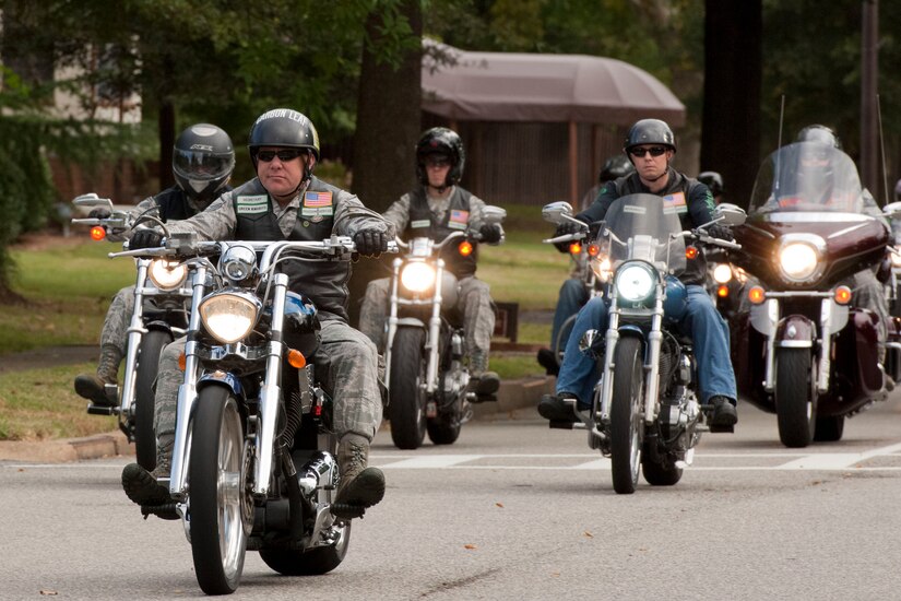 Members of the Green Knights Military Motorcycle Club ride their motorcycles on Langley Air Force Base Va., Sept. 26, 2013. Service members from all branches and their families are eligible to join the Department of Defense-sponsored motorcycle club. (U.S. Air Force photo by Staff Sgt. Stephanie Rubi/Released)