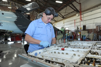 Ruben Pesina, 12th Flying Training Wing maintenance division aircraft mechanic, repairs a panel from a T-38 Talon aircraft during a phase inspection Nov. 18 at Joint Base San Antonio-Randolph. (U.S. Air Force photo by Rich McFadden)