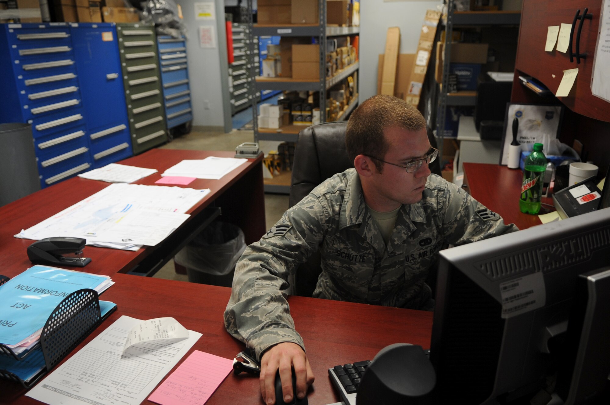 Senior Airman Joshua Schutte, a 19th Logistics Readiness Squadron vehicle maintenance material controller, processes an order for a part Sept. 11, 2013, at Little Rock Air Force Base, Ark. More than 190 orders are processed and maintained for parts, tools and purchases from vendors. (U.S. Air Force photo by Staff Sgt. Caleb Pierce)