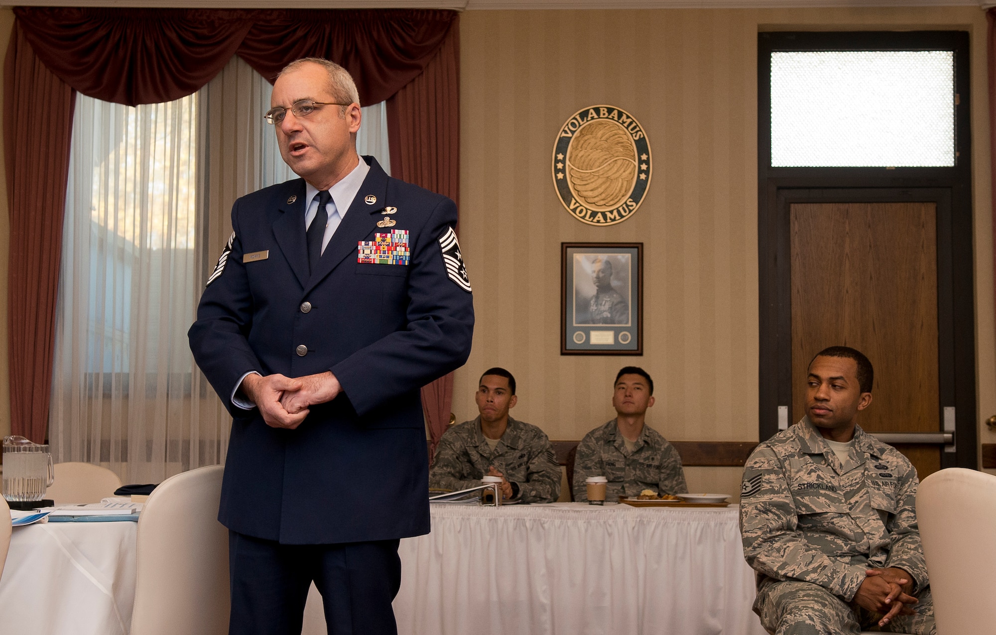 Chief Master Sgt. James Morris, 86th Airlift Wing command chief, tells an anecdote during the first Air Force Association meeting in more than four years, Nov. 15, 2013, Ramstein Air Base, Germany. The AFA has been revived in an effort to educate the public and total force members on the heritage and importance of sustaining a dominant air, space and cyberspace organization while developing active members into effective leaders. (U.S Air Force photo/Senior Airman Jose L. Leon)