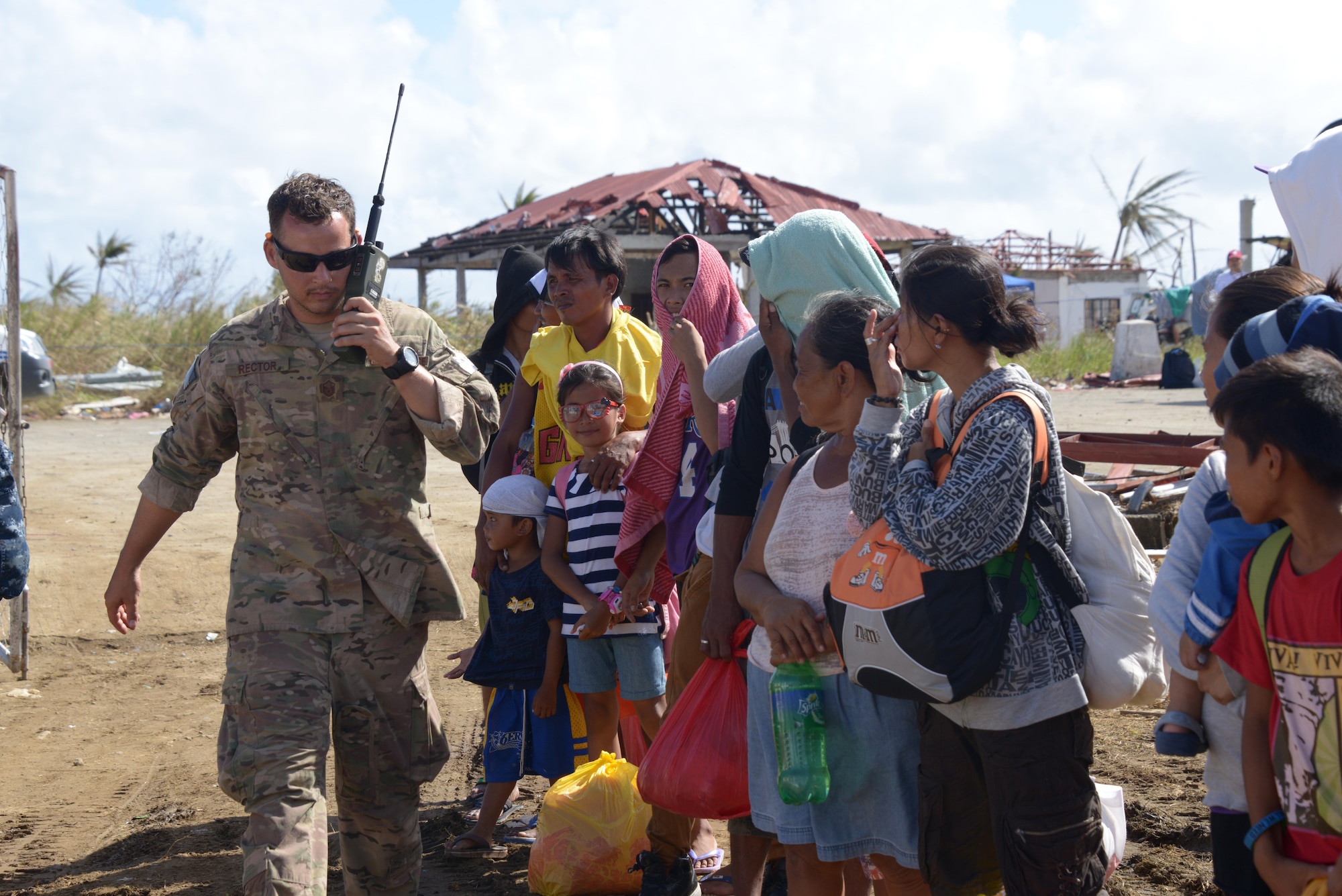 Master Sgt. Jeremy Rector, a Deployed Aircraft Ground Response Element team member assigned to the 353rd Special Operations Support Squadron, works to coordinate airlift Nov. 17, at Guiuan Airport, Philippines. Rector is deployed from Kadena Air Base, Japan in support of Operation Damayan to help transport Philippine citizens and ensure the delivery of food and supplies to those affected by Typhoon Haiyan. (U.S. Air Force photo by Tech. Sgt. Kristine Dreyer)  