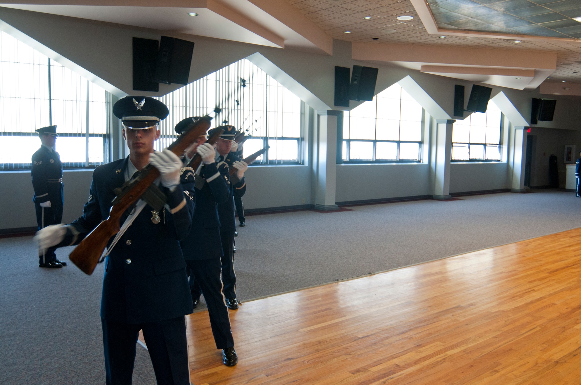 Ninetieth Missile Wing Honor Guard firing party ceremonial guardsmen demonstrate their role in a funeral ceremony in the Pronghorn Center here Nov. 15, 2013. The mock funeral in which they took part demonstrated the skills they learned during honor guard training to their supervisors, commanders and families. (U.S. Air Force photo by Airman 1st Class Jason Wiese)
