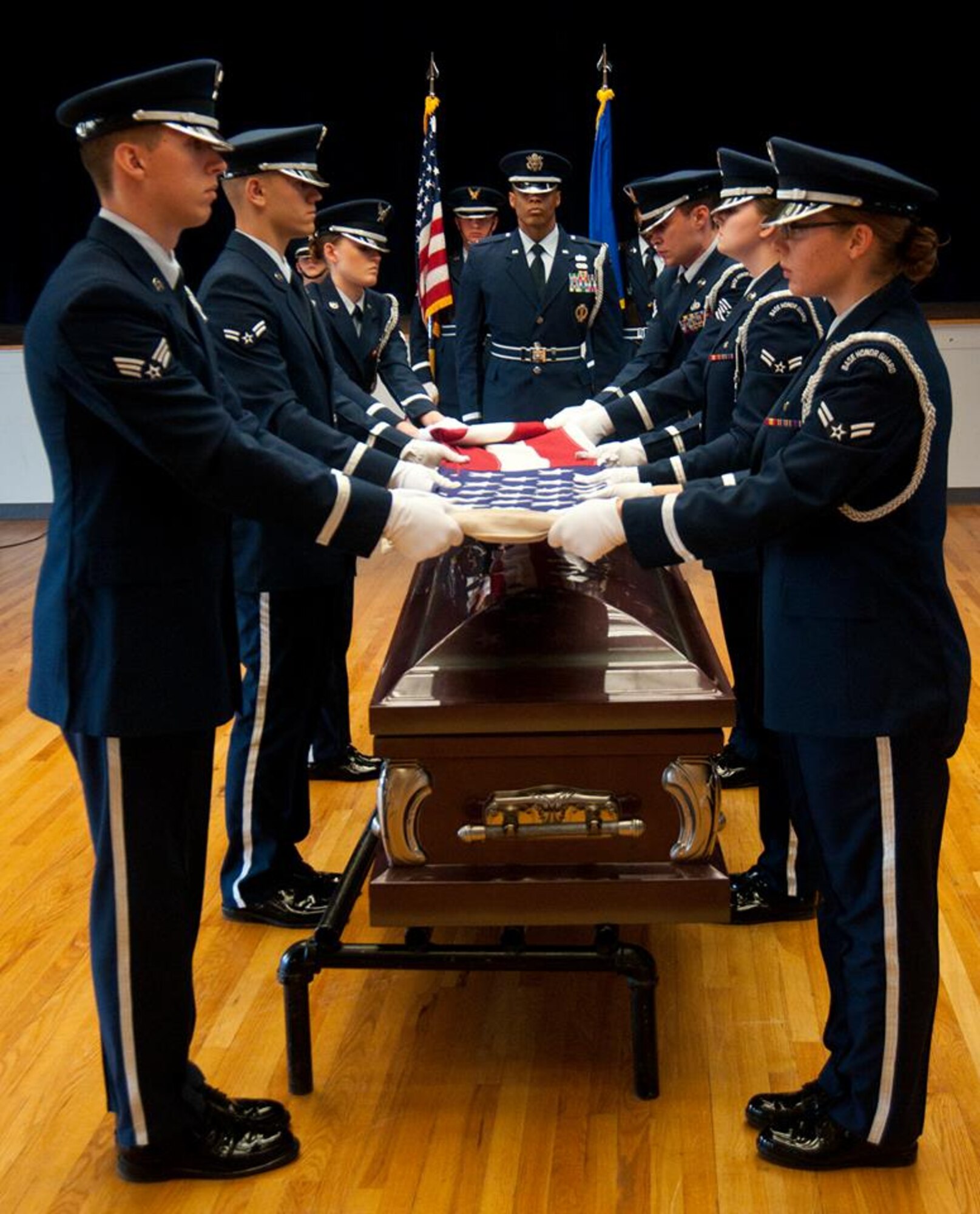 New members of the F.E. Warren Air Force Base Honor Guard perform a mock funeral ceremony for an audience of their respective organizations’ leaders and other guests to put the skills and precision they learned during Honor Guard training on display in the Pronghorn Center Nov. 15. Airmen who trained October or earlier in the year received their Honor Guard badges in an official graduation ceremony. (U.S. Air Force photo by Airman 1st Class Jason Wiese)
