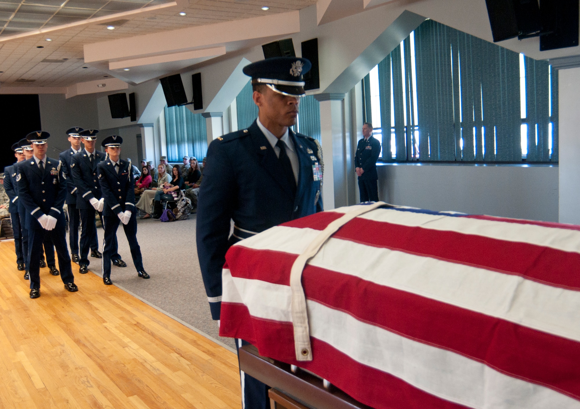 Second Lt. Michael Hartson, 320th Missile Squadron executive officer and newly graduated 90th Missile Wing ceremonial guardsman, acting as the officer-in-charge of the funeral detail in the Pronghorn Center here Nov. 15, 2013, begins a mock funeral ceremony intended to demonstrate the skills and precision he and his fellow graduates learned during two weeks of honor guard training. (U.S. Air Force photo by Airman 1st Class Jason Wiese)