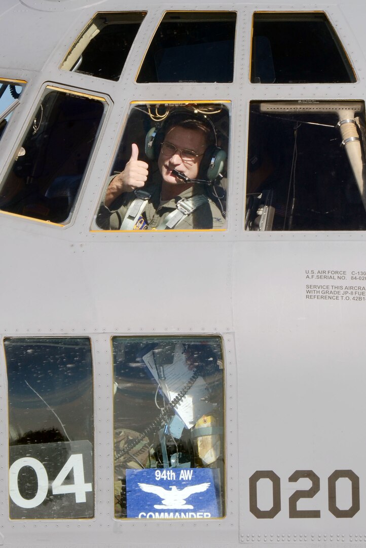 Col. Brett J. Clark, newly assigned 94th Airlift Wing commander gives the thumbs-up after completing his first flight at Dobbins Air Reserve Base, Ga., Nov. 19. Clark is responsible for over 2,500 wing personnel, and the entire installation comprised of 13 tenant units, including 22nd Air Force, Air Force Plant 6 and Lockheed-Martin, Georgia Army and Air National Guard and the Army, Navy and Marine Corps Reserves. (U.S. Air Force photo/Don Peek)