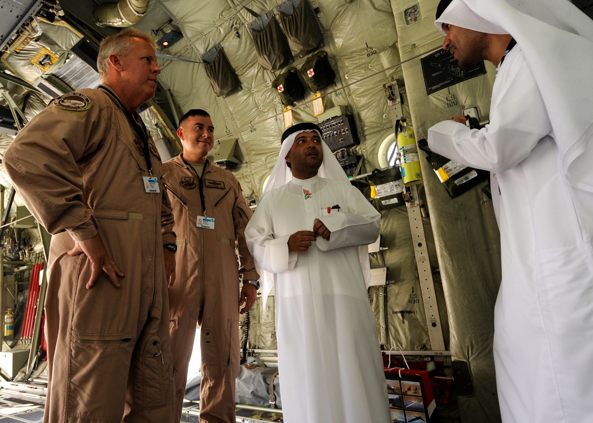 U.S. Air Force C-130J Hercules crew members talk to spectators during the 2013 Dubai Airshow at the Dubai World Central airport in Jebel Ali, Nov. 18, 2013. The C-130 crew is assigned to the 746th Expeditionary Airlift Squadron, 379th Air Expeditionary Wing, a total force integration unit, deployed form Keesler Air Force Base, Miss. (U.S. Air Force photo/Senior Airman Bahja J. Jones)