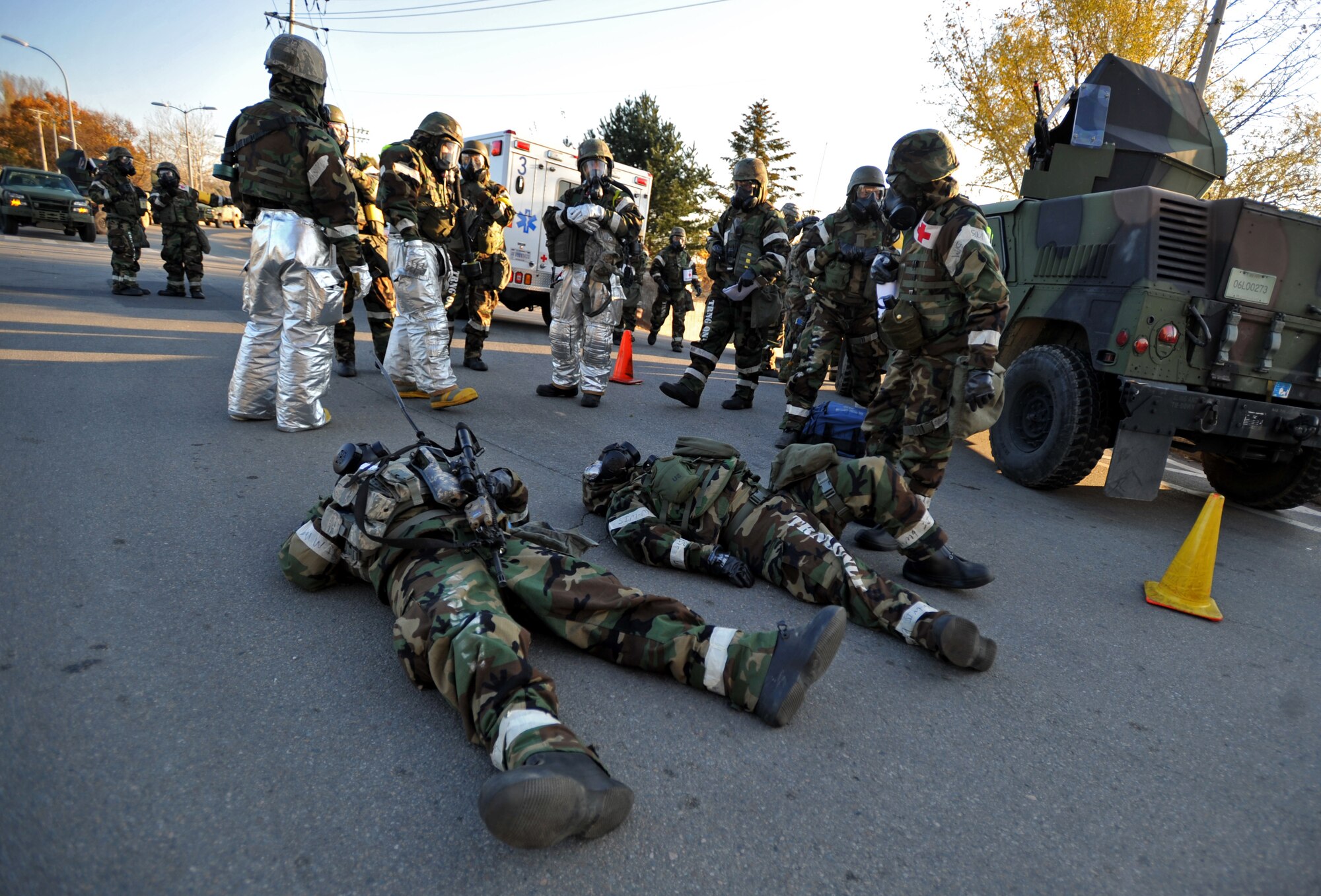 First responders from the 51st Medical Group and 51st Civil Engineer Squadron prepare to transport two simulated victims after the last ground attack of Operational Readiness Exercise Beverly Bulldog 14-01 at Osan Air Base, Republic of Korea, Nov. 21, 2013. Although all Airmen are taught a measure of self aid and buddy care, medical personnel continue to be the focal point for preserving life, limb and eyesight. (U.S. Air Force photo/Senior Airman Siuta B. Ika)
