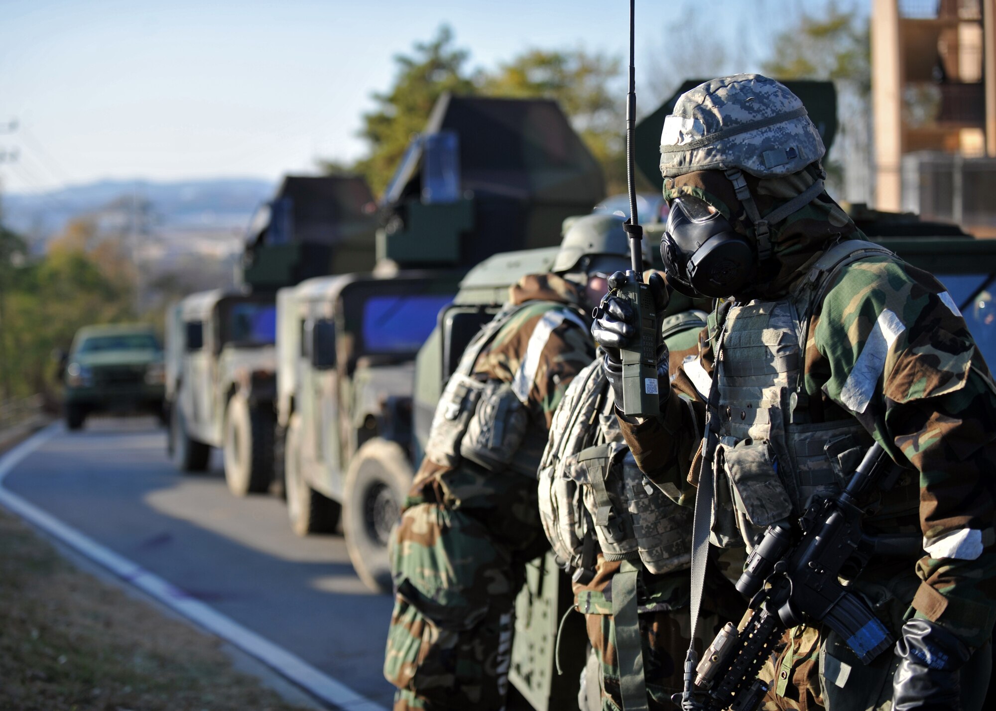 A member of the 51st Security Forces Squadron calls for emergency medical help after the last ground attack of Operational Readiness Exercise Beverly Bulldog 14-01 at Osan Air Base, Republic of Korea, Nov. 21, 2013. First responders from the 51st Medical Group and 51st Civil Engineer Squadron came to the aid of the 51st SFS after the defenders neutralized the opposition forces members. (U.S. Air Force photo/Senior Airman Siuta B. Ika)
