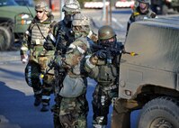 Members of the 51st Security Forces Squadron take on opposition forces during the last ground attack of Operational Readiness Exercise Beverly Bulldog 14-01 at Osan Air Base, Republic of Korea, Nov. 21, 2013. Scenarios like this give Airmen a chance to hone wartime skills in a safe and structured environment in preparation for real-world contingencies. (U.S. Air Force photo/Senior Airman Siuta B. Ika)