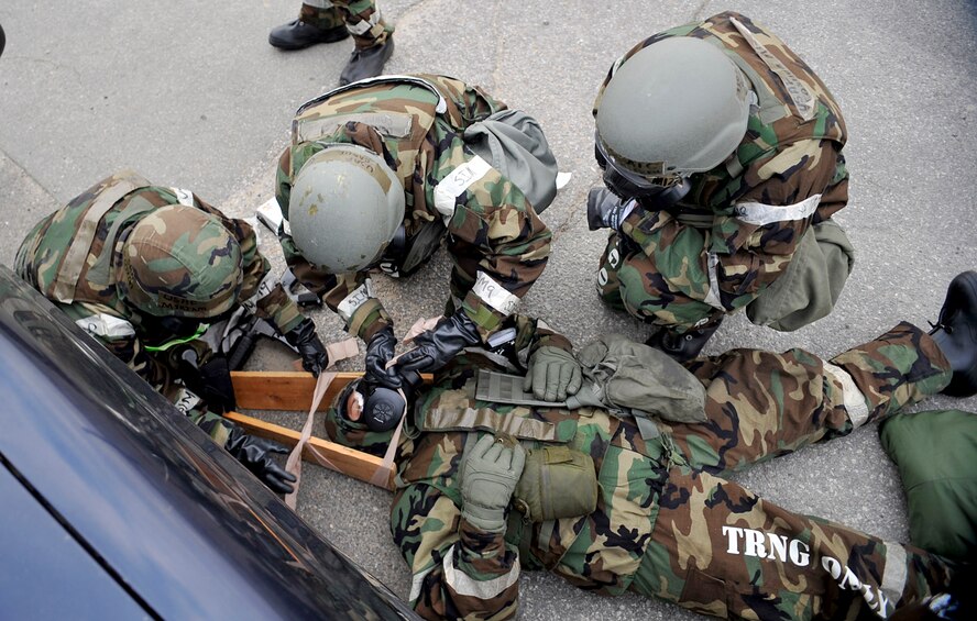 First responders immobilize a simulated victims head during Operational Readiness Exercise Beverly Bulldog 14-01 at Osan Air Base, Republic of Korea, Nov. 21,2013. Mass casualty situations in a real-world operation could require Airmen to call on their knowledge of not only care in a conventional setting, but also of care under fire. (U.S. Air Force photo/Staff Sgt. Emerson Nuñez)