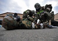 Members of the 51st Logistics Readiness Squadron tend to the wounds of a simulated victim during a mass casualty exercise scenario during Operational Readiness Exercise Beverly Bulldog 14-01 at Osan Air Base, Republic of Korea, Nov. 21, 2013. Scenarios like this gives Airmen a chance to hone wartime skills in a safe and structured environment in preparation for real-world contingencies. (U.S. Air Force photo/Senior Airman Siuta B. Ika)