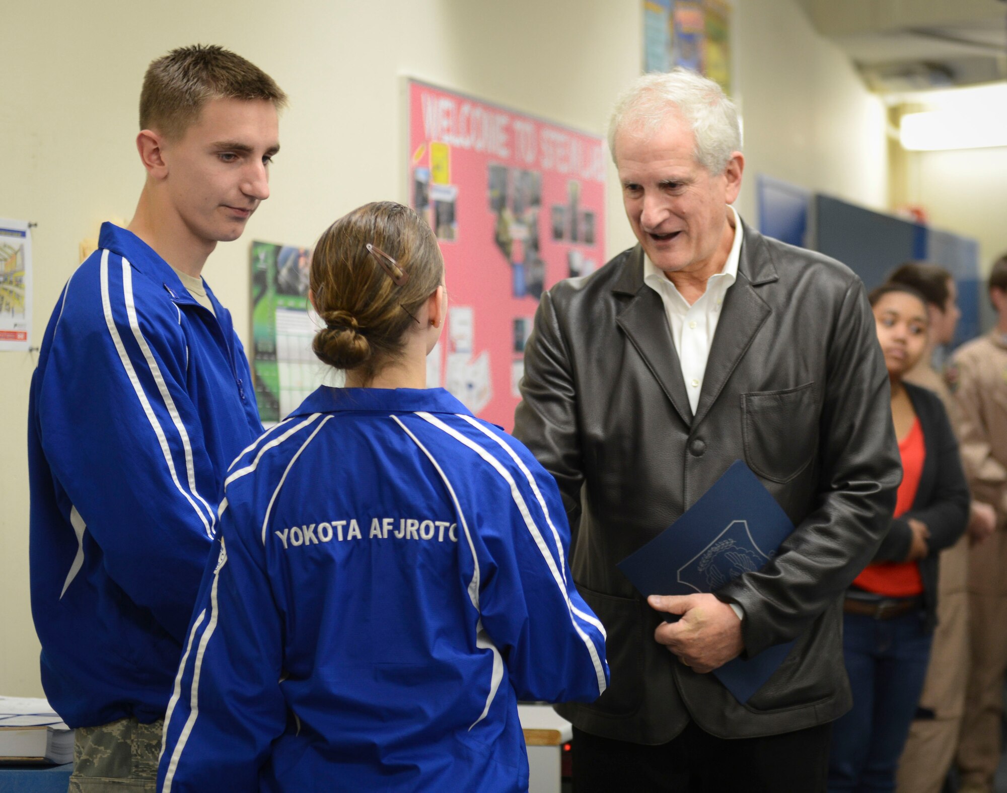 Dr. Edwin Schlossberg meets with Yokota High School's Junior ROTC cadets at Yokota Air Base, Japan, Nov. 21, 2013.  The Yokota cadets showed Schlossberg their "Science, Technology, Engineering, Mathematics" Laboratory, recently recognized as a national "Best Practice" for their cadet-built, laboratory. (U.S. Air Force photo by Airman 1st Class Meagan Schutter/Released)