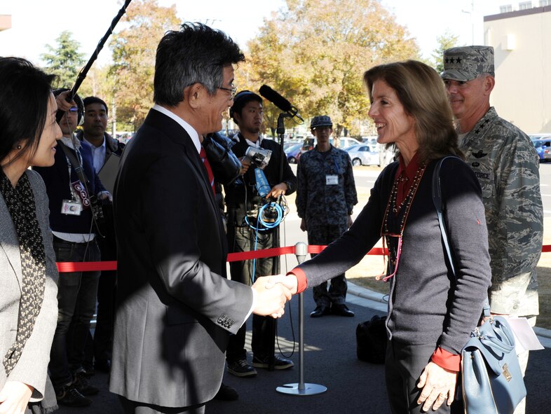 Caroline Kennedy, U.S. Ambassador to Japan, shakes hands with Ryota Takeda, Japan Parliamentary Senior Vice Minister of Defense, Nov. 21, 2013, at Yokota Air Base, Japan. Kennedy visited Yokota to learn about the mission of U.S. Forces, Japan, and the partnership with the Japan Self-Defense Force. (U.S. Air Force photo by Senior Airman Desiree Economides/Released)