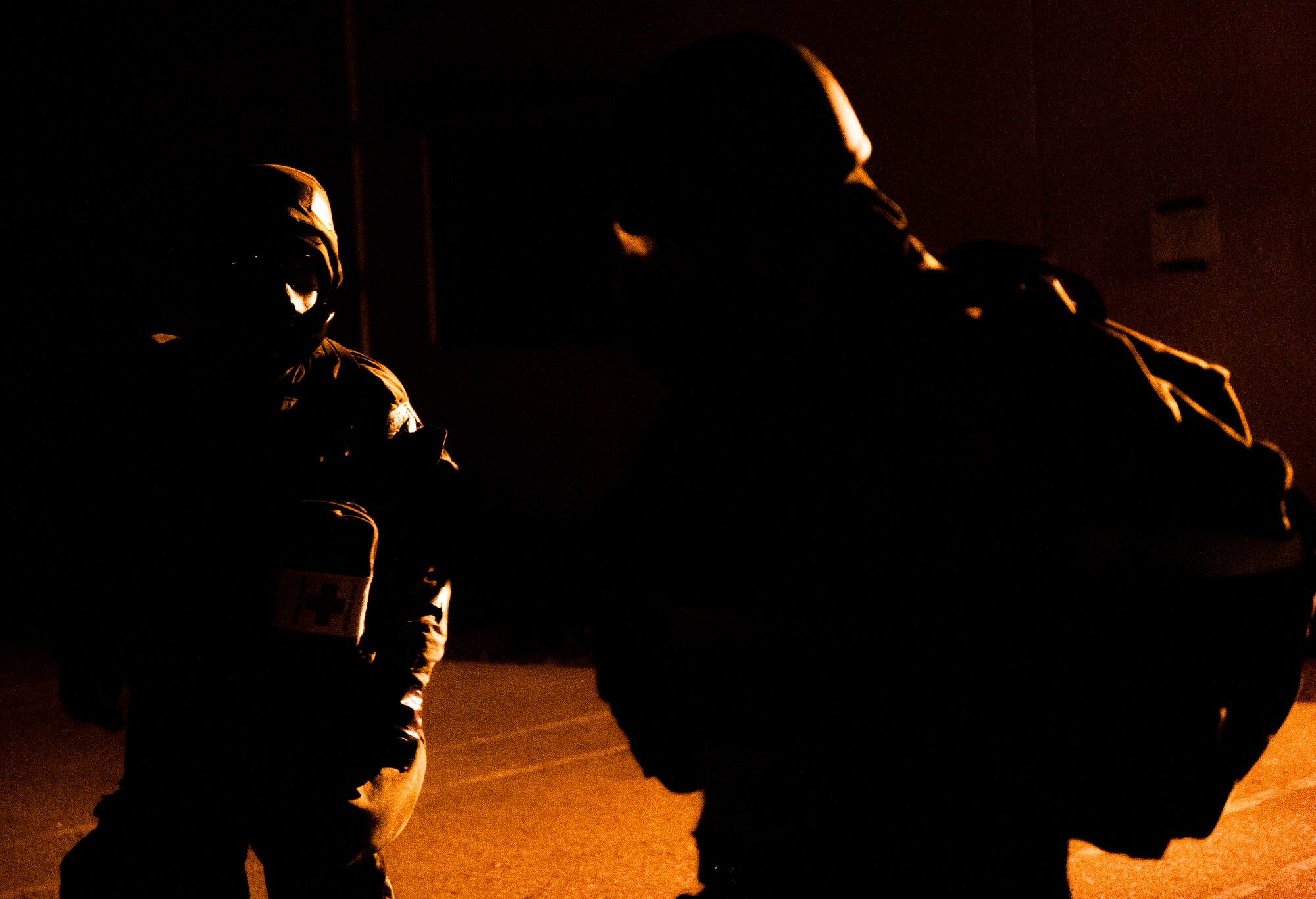 Airmen from the 8th Medical Group perform buddy checks before traveling through a contaminated building during exercise Beverly Bulldog 14-01 at Kunsan Air Base, Republic of Korea, Nov. 21, 2013. Buddy checks are performed to ensure protective gear is worn properly to limit exposure to chemical agents. (U.S. Air Force photo by Senior Airman Clayton Lenhardt/Released)