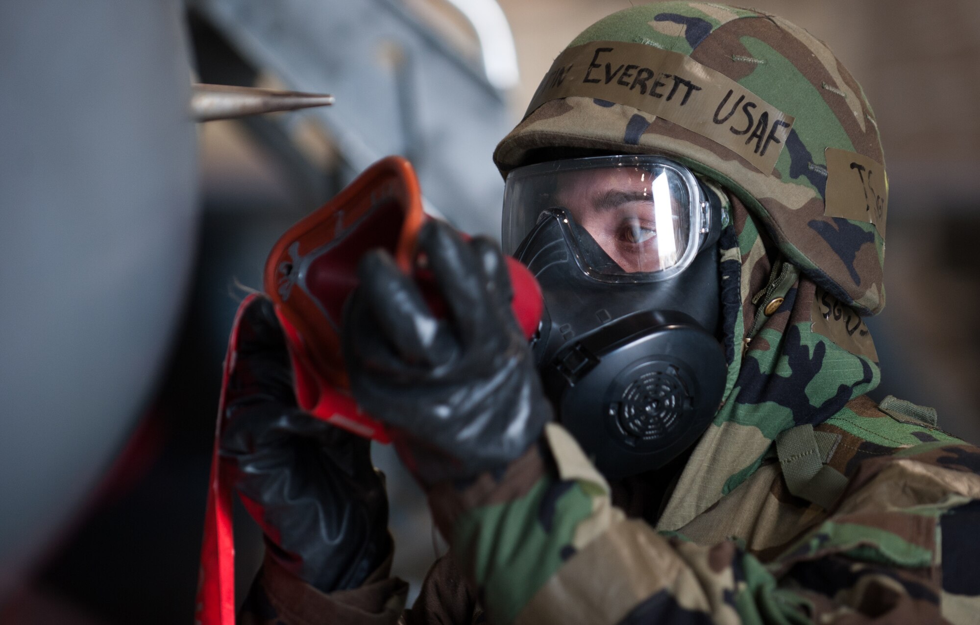 Tech. Sgt. Justin Everett, 8th Aircraft Maintenance Squadron, readies a F-16 Fighting Falcon for take off during an exercise at Kunsan Air Base, Republic of Korea, Nov. 20, 2013. Kunsan’s pilots and maintainers continued to launch F-16 Fighting Falcons during a simulated chemical environment. The base tested its ability to generate aircraft under simulated hostile field conditions. The Wolf Pack, along with other 7th Air Force units, continued performing its operational and tactical wartime missions during the peninsula-wide exercise Beverly Bulldog 14-01. (U.S. Air Force photo by Senior Airman Armando A. Schwier-Morales)