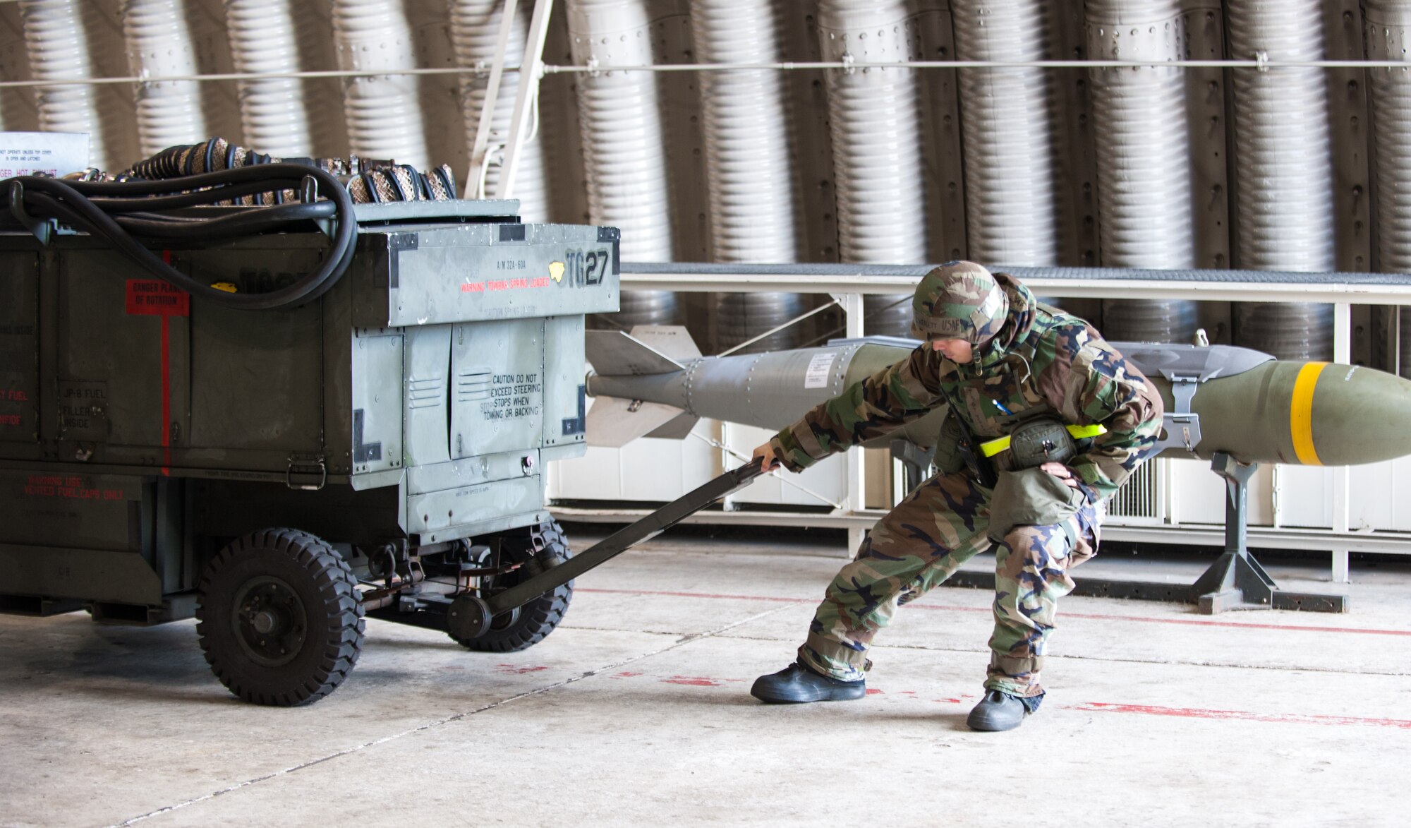 Tech. Sgt. Justin Everett, 8th Aircraft Maintenance Squadron, readies a shelter for an F-16 Fighting Falcon during an exercise at Kunsan Air Base, Republic of Korea, Nov. 20, 2013. Kunsan’s pilots and maintainers continued to launch F-16 Fighting Falcons during a simulated chemical environment. The base tested its ability to generate aircraft under simulated hostile field conditions. The Wolf Pack, along with other 7th Air Force units, continued performing its operational and tactical wartime missions during the peninsula-wide exercise Beverly Bulldog 14-01. (U.S. Air Force photo by Senior Airman Armando A. Schwier-Morales)