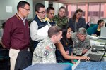 South Carolina National Guard members visit the Colombia emergency services (UNGRD) office to see their programs in action, Sept. 13, 2013, in Bogota.