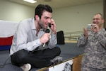 Zachary Quinto, who plays "Spock" in the new "Star Trek" movie, talks to the daughter of Chief Warrant Officer Earl Hemminger of the Virginia National Guard after the "Star Trek" world premiere at Camp Arifjan, Kuwait on April 11, 2009.