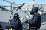 Nuclear, biological and chemical team members from the 1st Civil Support Team of the Massachusetts National Guard survey a former Soviet naval ship for radioactive material during a training exercise March 4, 2009 at the Battle Ship Cove naval ship display in Fall River, Mass.