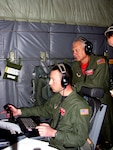 Command Sgt. Tech. Sgt. Tim Garrison and Master Sgt. Glenn Hancock of the Mississippi Guard's 186th Air Refueling Wing get hands-on ISR training on the Scathe View system aboard a Reno-based C-130.