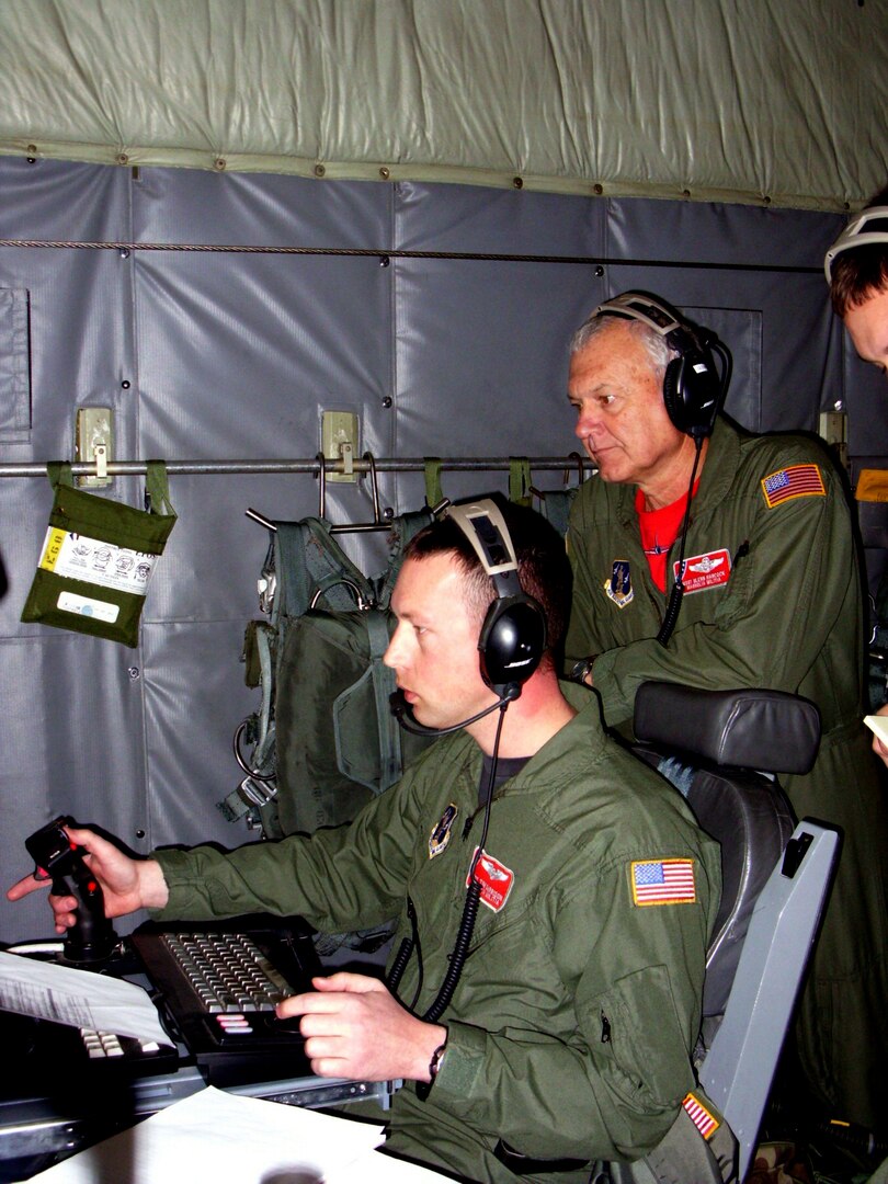 Command Sgt. Tech. Sgt. Tim Garrison and Master Sgt. Glenn Hancock of the Mississippi Guard's 186th Air Refueling Wing get hands-on ISR training on the Scathe View system aboard a Reno-based C-130.