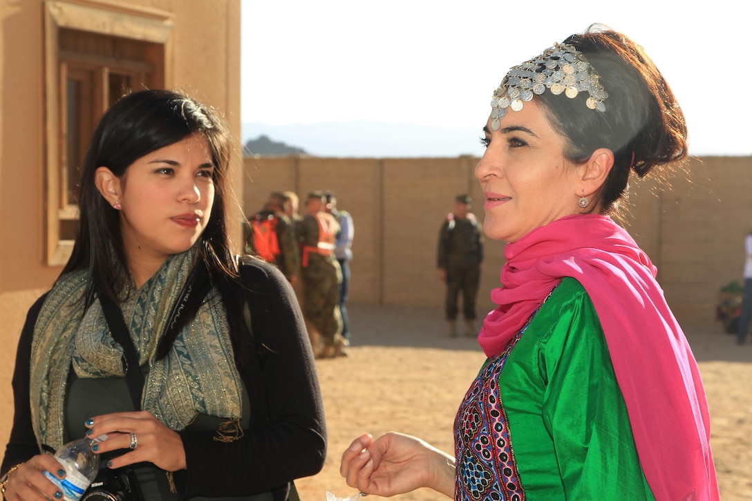 Mariam Abassy, roleplayer, speaks with service member spouses during the Tactical Training Exercise Control Group's "A Day in the Life" event at Range 215 Nov. 17, 2013.



