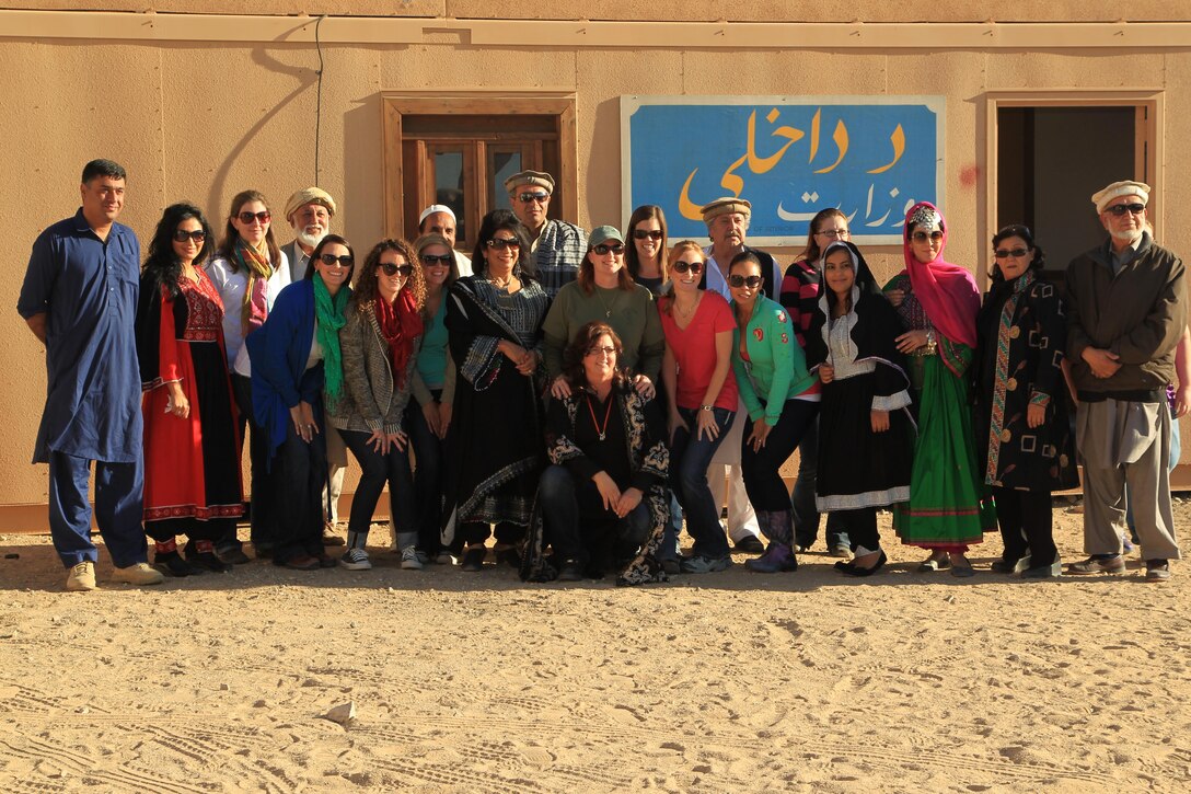 Service member spouses and Afghan roleplayers shared experiences during the Tactical Training Exercise Control Group's "A Day in the Life" event at Range 215 Nov. 17, 2013.


