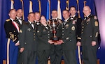 Members of the Virginia National Guard pose with the 2008 Connelly Award April 2 in Atlanta. The 1032nd Transportation Company was awarded the Connelly Award for excellence in Army Food Service in the National Guard Field Kitchen Category for 2008. Members of the unit who attended the awards ceremony include: 1st Sgt. E. Tim Miller - Staff Sgt. Allen Osburn, Staff Sgt. Ralph Norris, Sgt. Vincent Woodmancy, Sgt. Paul Woodmancy, Spc. Julie Woodby, Spc. Gary Martin, Spc. Brandon Sexton and Spc. Billy Rose.