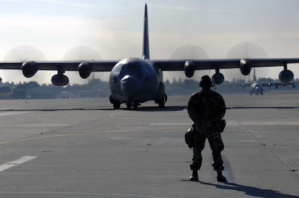 Two MC-130P Combat Shadow tanker aircraft from the 129th Rescue Wing, Moffett Federal Airfield, Calif., taxi on the Moffett flightline. A test version of the communication format called Situation Awareness Data Link, or SADL, was recently installed and evaluated on a 129th MC-130P Combat Shadow tanker.