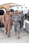 Gen. Craig R. McKinley, chief of the National Guard Bureau, walks with Brig. Gen Steven P. Huber, commander of Task Force Phoenix VIII, during a recent visit to Camp Phoenix, Kabul, Afghanistan. McKinley was visiting the National Guard Troops assigned to Camp Phoenix in March.