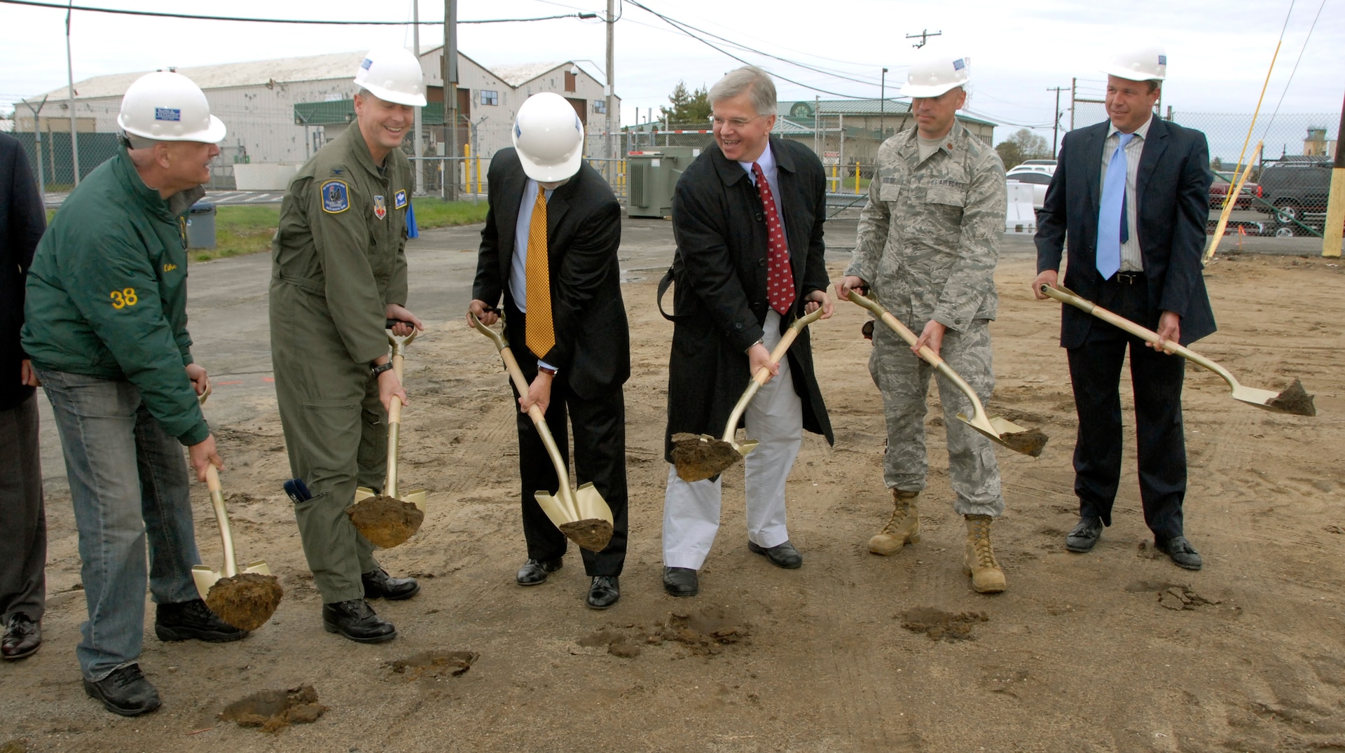 Michael Jacobs, chairman of the Board of the Friends of the 106th, Col. Michael F. Canders of the 106th Rescue Wing, Congressman Timothy Bishop, New York State Assemblyman Fred Thiele, Maj. John D. McElroy of the 103rd Rescue Squadron, and Keith Wood, supervisor for Racanelli Construction, break ground for a new building to house the 103rd Rescue Squadron at F.S. Gabreski Air National Guard Base in Westhampton Beach, N.Y., on May 2, 2009.