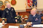 Maj. Gen. Raymond W. Carpenter, acting deputy director of the Army National Guard, and Lt. Gen. Harry M. Wyatt III, director of the Air National Guard, prepare to testify before the House Armed Services Committee Air and Land Forces Subcommittee on May 5, 2009.