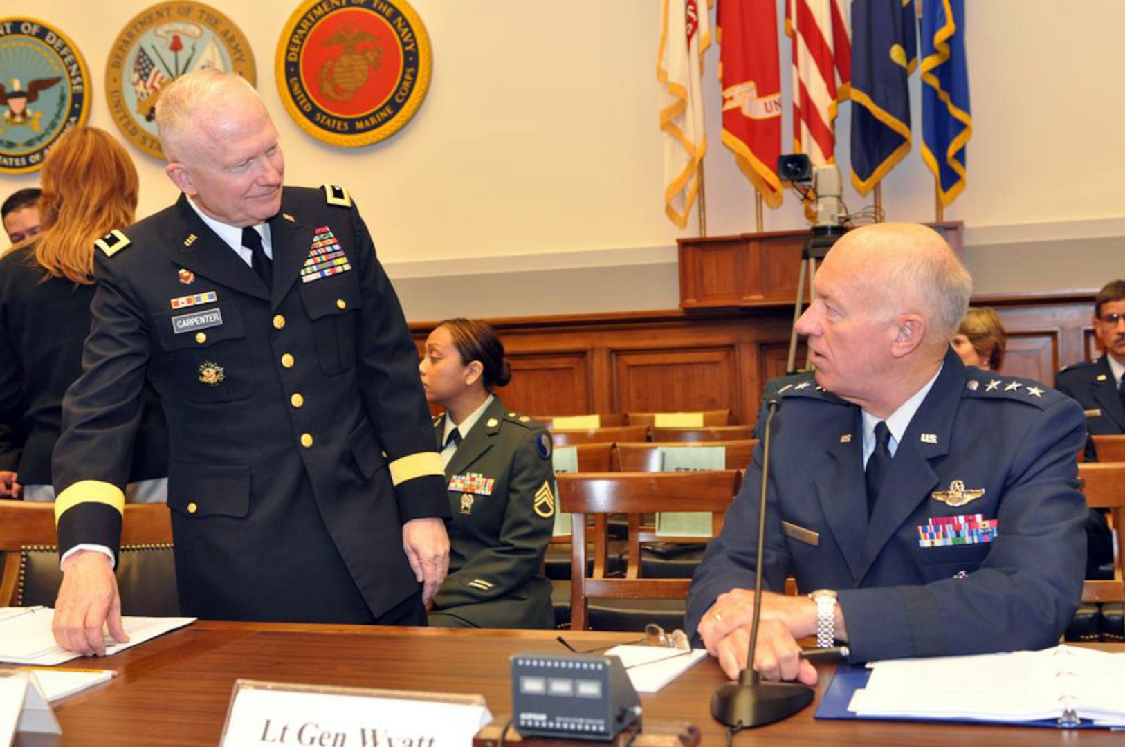 Maj. Gen. Raymond W. Carpenter, acting deputy director of the Army National Guard, and Lt. Gen. Harry M. Wyatt III, director of the Air National Guard, prepare to testify before the House Armed Services Committee Air and Land Forces Subcommittee on May 5, 2009.