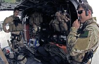 First Lt. Brent McCall, 101st Expeditionary Rescue Squadron combat rescue officer, and Tech. Sgt. Jedediah Smith, 101st ERQS pararescueman, load up their gear for a training mission in Northeastern Afghanistan, April 20. In addition to an M-4 assault rifle, combat medical gear and body armor, Sergeant Smith also packs his four-year-old daughter Mia's pre-school class teddy bear. The seven-year New York Air National Guardsman said he brings the little guy along with him on all his missions and writes letters to her school on behalf of the bear. "He pretty much goes everywhere I go," Sergeant Smith said, including the eight combat search and rescue missions he's done since he deployed here.