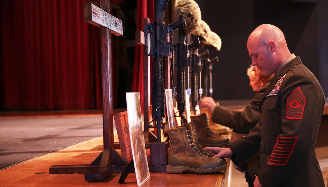 A Memorial service was held at the Base Theatre at 10 a.m. today in honor of Gunnery Sgt. Gregory J. Mullins, Staff Sgt. Mathew R. Marsh, Sgt. Miguel Ortiz and Staff Sgt. Eric W. Summers.

The four Explosive Ordnance Disposal Marines were killed in an explosion at approximately 11 a.m. November 13 during range maintenance operations to dispose of unexploded ordnance in the Zulu impact area aboard Marine Corps Base Camp Pendleton.

"Today, we pause for a moment to remember our fallen comrades: their lives, service and sacrifice. We, their Marine Family, mourn alongside their loved ones. We will always remember their commitment and devotion to duty," said Brig. Gen. John W. Bullard, Commanding General, Marine Corps Installations West- Marine Corps Base Camp Pendleton.