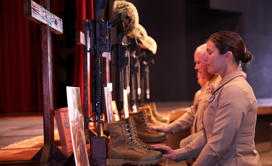 A Memorial service was held at the Base Theatre at 10 a.m. today in honor of Gunnery Sgt. Gregory J. Mullins, Staff Sgt. Mathew R. Marsh, Sgt. Miguel Ortiz and Staff Sgt. Eric W. Summers.

The four Explosive Ordnance Disposal Marines were killed in an explosion at approximately 11 a.m. November 13 during range maintenance operations to dispose of unexploded ordnance in the Zulu impact area aboard Marine Corps Base Camp Pendleton.

"Today, we pause for a moment to remember our fallen comrades: their lives, service and sacrifice. We, their Marine Family, mourn alongside their loved ones. We will always remember their commitment and devotion to duty," said Brig. Gen. John W. Bullard, Commanding General, Marine Corps Installations West- Marine Corps Base Camp Pendleton.