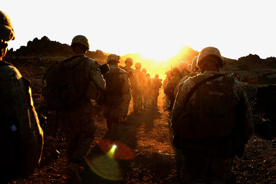 Marines with 81mm Mortars platoon, Weapons Company, 3rd Battalion, 5th Marine Regiment, hikes up a hill before conducting a counter-improvised-explosive device exercise at Range 215, Nov. 15.