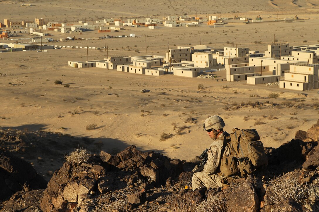 A Marines with 81mm mortars platoon, Weapons Company, 3rd Battalion, 5th Marine Regiment, provides security during a partol while conducting a counter-improvised-explosive device exercise at Range 215, Nov. 15, 2013.