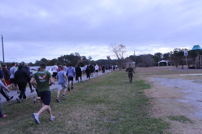 Marines with Transportation and Support Company, Combat Logistics Battalion 2, 2nd Marine Logistics Group run a 5k to commemorate Cpl. Christopher M. Monahan Jr. and Lance Cpl. Dale W. Means aboard Camp Lejeune, N.C., Nov. 22, 2013. Monahan and Means were both killed in action while conducting combat operations in Helmand province, Afghanistan, in support of Operation Enduring Freedom.