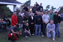 The family of Cpl. Christopher M. Monahan Jr. (center) and Marines with Transportation and Support Company, Combat Logistics Battalion 2, 2nd Marine Logistics Group pose for a picture after participating in a memorial 5k at a park aboard Camp Lejeune, N.C., Nov. 22, 2013. Service members, family and friends gathered to commemorate Monahan and Lance Cpl. Dale W. Means, Marines who were killed in action, with a 5k and cookout.