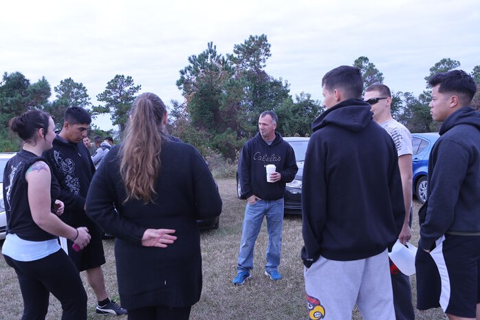 Marines with Transportation and Support Company, Combat Logistics Battalion 2, 2nd Marine Logistics Group talk to the Monahan family before a memorial 5k at a park aboard Camp Lejeune, N.C., Nov. 22, 2013. Cpl. Christopher M. Monahan Jr. and Lance Cpl. Dale W. Means were both killed in action, while conducting combat operations in Helmand province, Afghanistan in support of Operation Enduring Freedom.