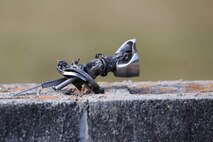 A doorknob lies on a cinderblock wall after being removed from debris in the aftermath of a door-breaching detonation a demolition training exercise aboard Camp Lejeune, N.C., Nov. 20, 2013. Door-breaching charges were among the explosives used by Improved Ribbon Bridge Platoon to train for urban and path-clearing operations.