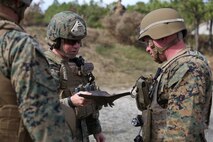 Marines with Improved Ribbon Bridge Platoon, 8th Engineer Support Battalion, 2nd Marine Logistics Group inspect a steel plate used to hold an explosive charge a during demolition training exercise aboard Camp Lejeune, N.C., Nov. 20, 2013. The training was used familiarize the service members with basic demolitions to enable the safe employment of explosives in a combat environment.