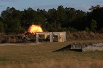 A fireball erupts from a “junk shot” used by Marines with Ribbon Bridge Platoon, 8th Engineer Support Battalion, 2nd Marine Logistics Group to expend all unused explosives during a demolition training exercise aboard Camp Lejeune, N.C., Nov. 20, 2013. The service members detonated approximately 30 explosive charges to train for future operations with urban, path-clearing and anti-personnel devices.