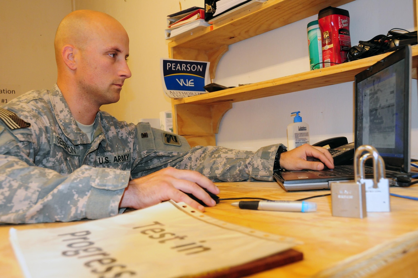 Army Spc. Ryan Severson from Headquarters Company, 81st Brigade Combat Team, Washington Army National Guard, spends his off time working at the Camp Ramadi testing and education center. Severson and some of his friends and co-workers created the testing center after he discovered how few education resources were available on Camp Ramadi, Iraq.