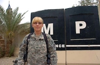Army Sgt. Anne M. Mitchell misses her children in Montana while she's deployed in Iraq, but those her serve with her say she brings her mothering instincts to their unit, the 143rd Military Police Detachment, Baghdad, 2009.