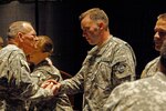 Colorado Army National Guard Staff Sgt. Nathanial Johnson is congratulated on his selecation as the Army Band Junior NCO of the Year for Reserve Components at a ceremony in Virginia Beach, Virginia, April 22.