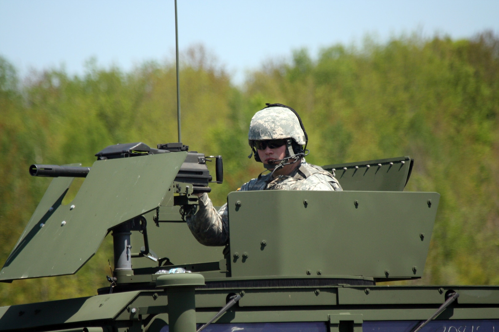 New York Army National Guard Private 1st Class Jerald Russell from the 206th Military Police Company mans the gunner position during reactions to an Improvised Explosive Device (IED) while training at the New York State Emergency Preparedness Center in Oriskany, N.Y. on May 13. The Army National Guard Soldiers completed their IED training as part of their preparation for mobilization and deployment to Iraq later this summer.