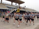Capt. David N. Redmond, of Everett, Wash., with the Headquarters and Headquarters Company 1st Battalion, 161st Infantry Regiment, leads the Highlander pack at the start of the 5K run during the Highlander games at Joint Base Balad, Iraq April 30.